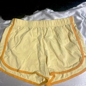 M shorts, dark yellow with orange lines